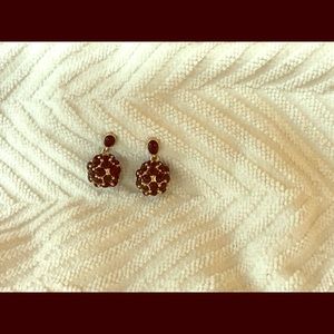 Gold tone and black earrings